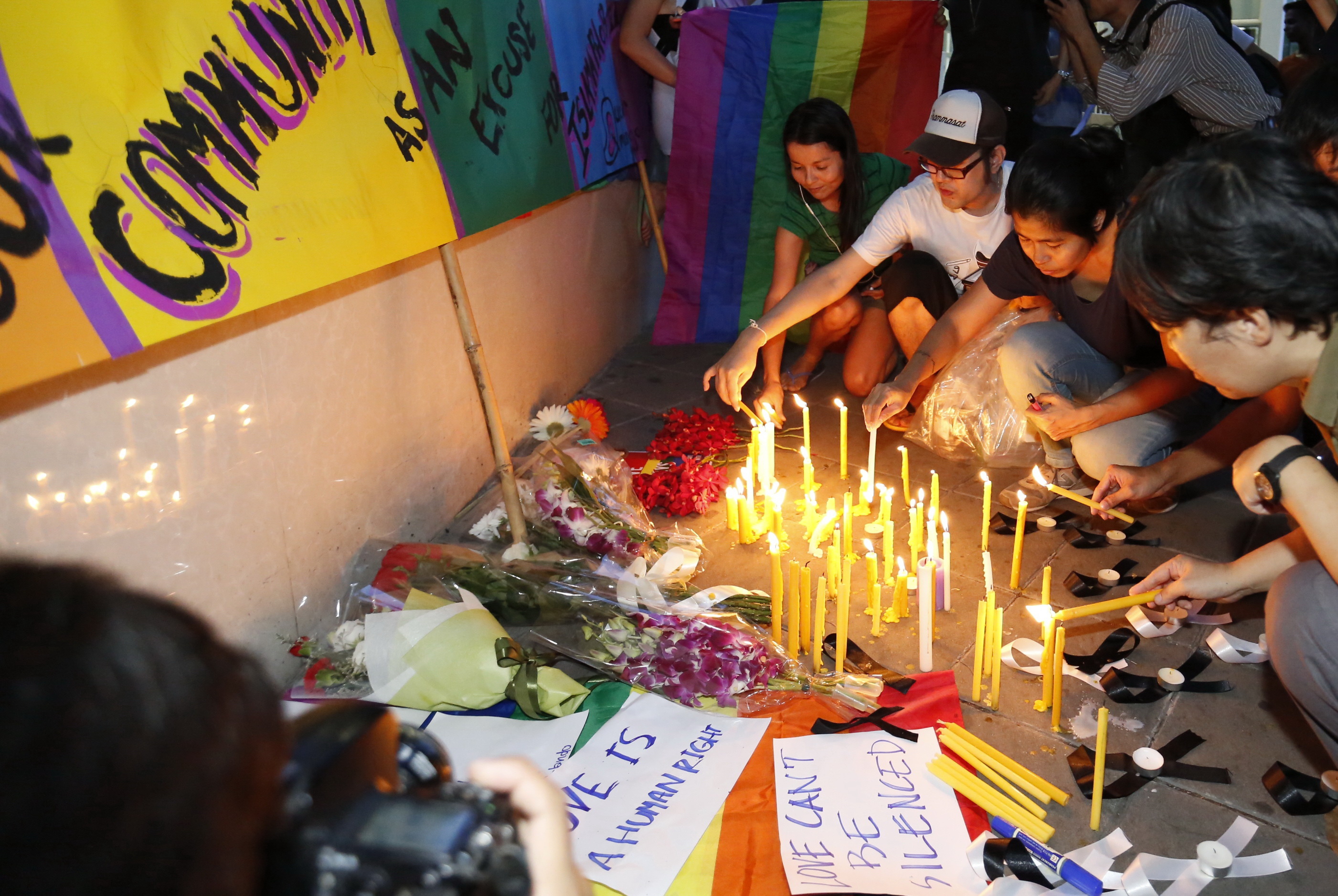 A vigil held for victims of the Orlando shooting Monday in front of the US Embassy in Bangkok.
