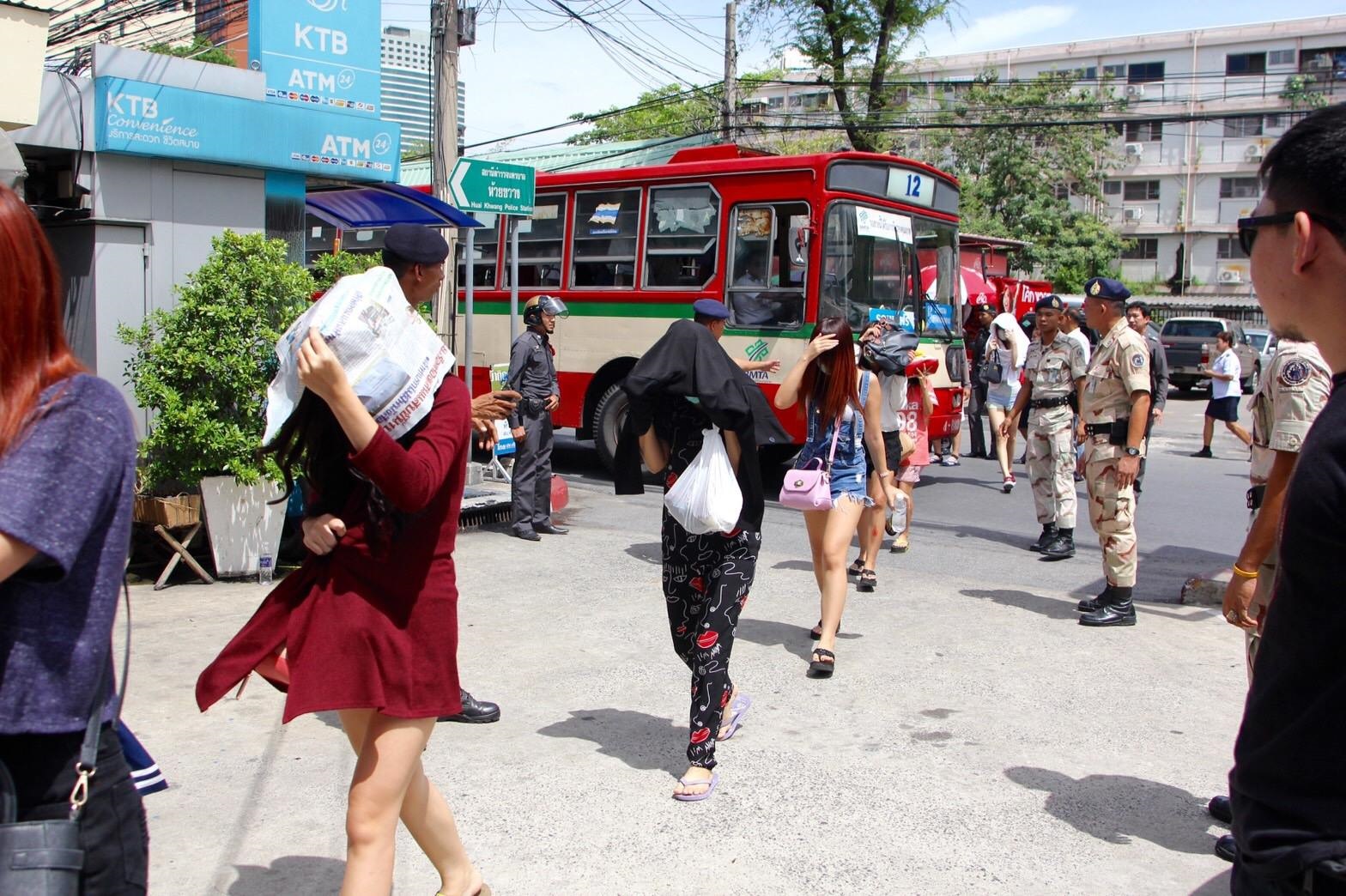 Sex workers rescued from Nataree Entertainment were brought to Huai Khwang Police Station on June 8, 2016, for questioning.