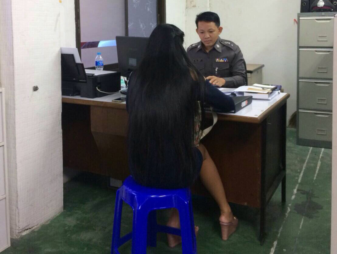The ‘ghost rider’ turns herself in for clinging to a moving vehicle Thursday afternoon at the Hua Mak Police Station.