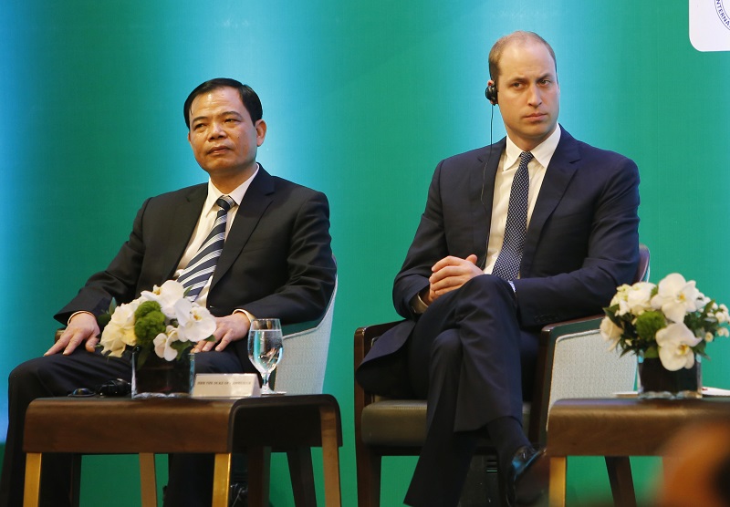 Vietnam's Minister of Agriculture Nguyen Xuan Cuong, left, and Britain's Prince William, Duke of Cambridge, right, listen to a speech at an international conference on illegal wildlife trade Thursday in Hanoi, Vietnam. Photo: Tran Van Minh / Associated Press