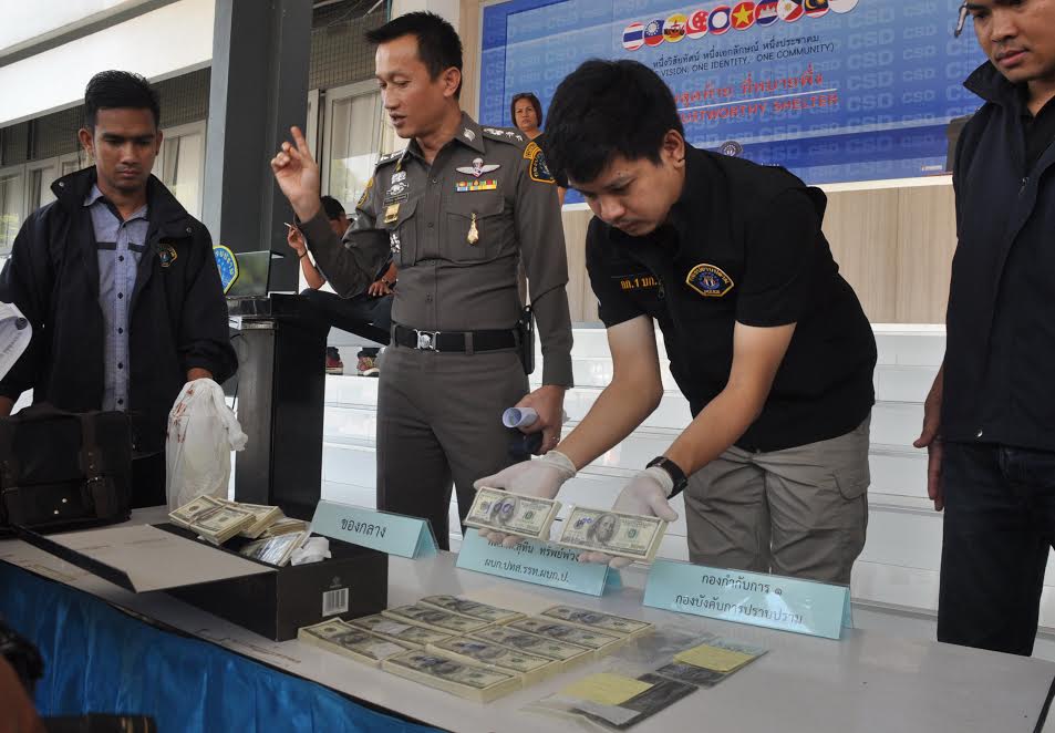 Police display counterfeited U.S. dollars seized from a suspected forgery ring on Wednesday in Bangkok’s Bang Kapi district.