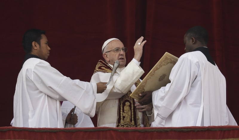 Pope Francis delivers the Urbi et Orbi (Latin for ' to the city and to the world' ) Christmas' day blessing last December from the main balcony of St. Peter's Basilica at the Vatican. Photo: Alessandra Tarantino / Associated Press