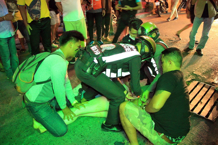 Officers subdue the unidentified suspect Wednesday night in downtown Pattaya city.