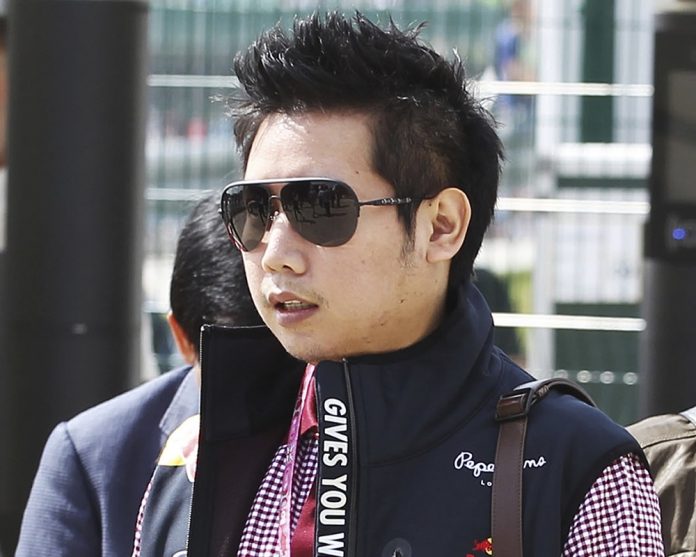 Boss Red Bull Vorayuth 'Boss' Yoovidhya, who has evaded justice for years in the death of a Thonglor police officer, spotted in 2013 at the British Formula 1 Grand Prix in Silverstone, England, in a photo provided by XPB Images. Photo: XPB Images / Associated Press