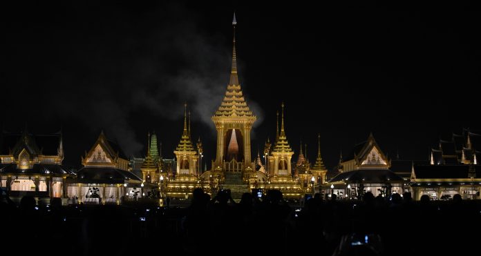 Smoke lingers in the air above the crematorium Thursday in Sanam Luang.