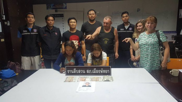Alexander Mamichev, 54, points at Suthirak Toloy and Sudarat Pandjanteuk, who allegedly stole about 35,000 baht worth in different currencies from his hotel room in Pattaya.