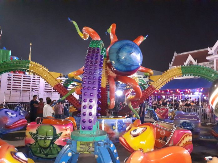 The aftermath at ‘The Octopus’ ride Sunday night at a temple fair in Samut Prakan. 15 were injured.