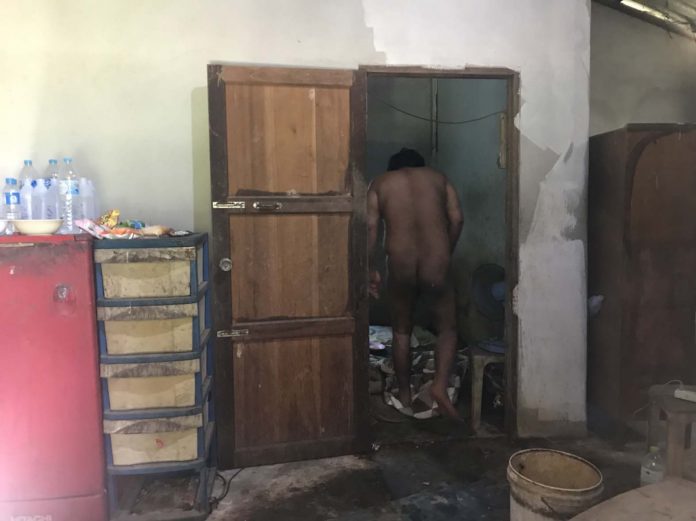 Paitun Kamwiratch, 30, in his room Tuesday in Rayong province.