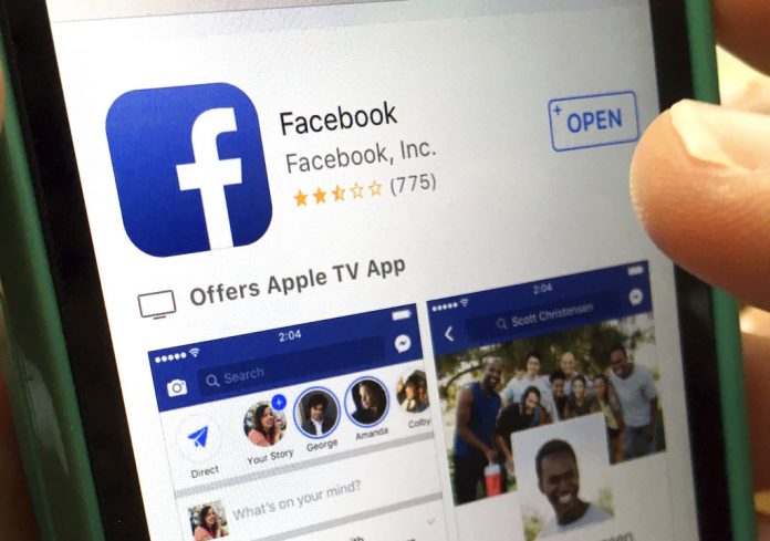 FILE - In this Monday, June 19, 2017, file photo, a user gets ready to launch Facebook on an iPhone, in North Andover, Mass. Photo: Elise Amendola / Associated Press