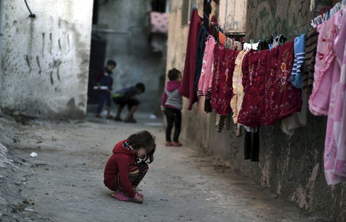 In this Thursday Jan. 11, 2018 photo, Palestinian children play in an alley at the Shati refugee camp in Gaza City. Photo: Khalil Hamra / Associated Press In this Thursday Jan. 11, 2018 photo, Palestinian children play in an alley at the Shati refugee camp in Gaza City. Photo: Khalil Hamra / Associated Press