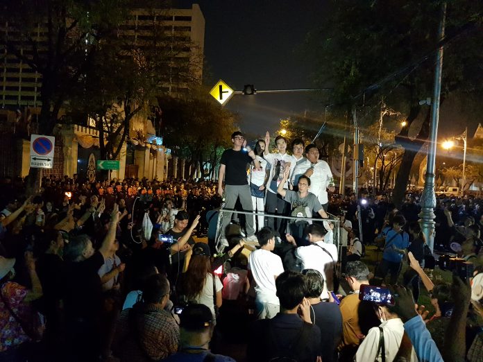 Standing on truck from left: Rangsiman Rome, Nuttaa Mahattana, Karn Pongprapaphan, Arnon Nampha, an unidentified woman and Sirawith Seritiwat at the pro-democracy protests Saturday.