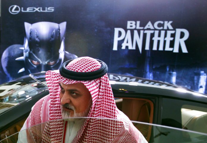 APTOPIX Saudi Cinema A visitor checks out a Lexus car, similar to a one used in the Black Panther film, that is on display at the King Abdullah Financial District Theater, in Riyadh, Saudi Arabia. Photo: Amr Nabil / Associated Press