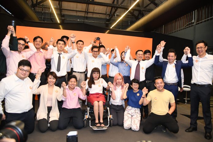 Thanathorn Juangroongruangkit, back row fifth from left, and the founding members of the Future Forward Party on March 15 at Warehouse Charoenkrung .