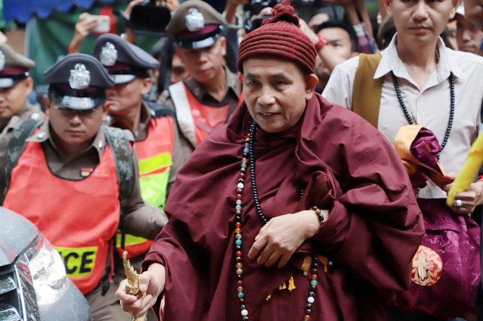 Kruba Boonchum, a prominent mystic from Myanmar, arrives at Luang Cave on Wednesday evening to perform a ritual of opening.