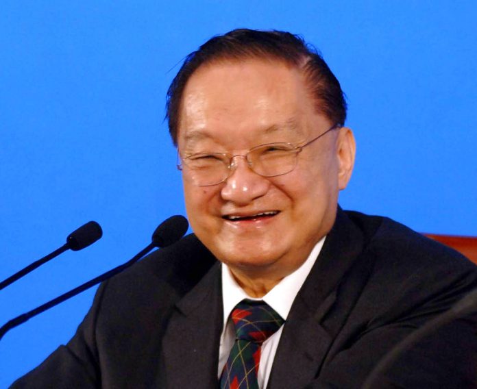 In this 2007 photo released by China's Xinhua News Agency, Louis Cha smiles during a speech at Peking University in Beijing. Photo: Luo Xiaoguang / Xinhua via AP