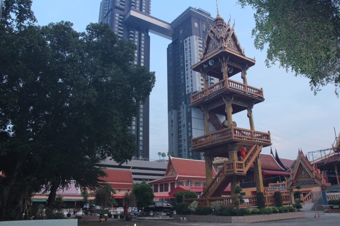 Wat Sai’s bell tower and the luxury condominium Star View.