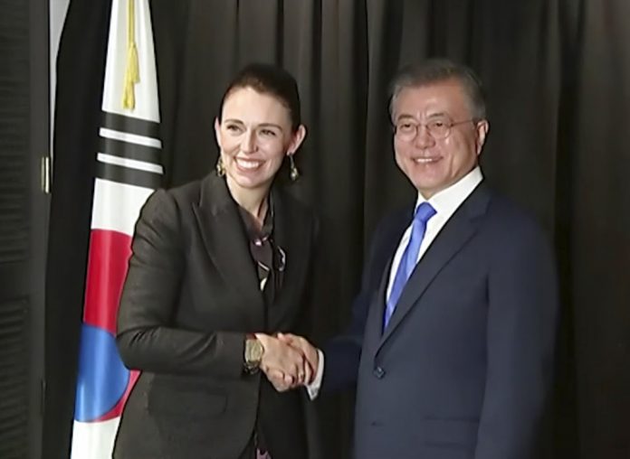 In this image made from a video, New Zealand's Prime Minister Jacinda Ardern, left, and South Korean President Moon Jae-in shake hands in Auckland, New Zealand Tuesday, Dec. 4, 2018. Photo: NZ POOL via AP