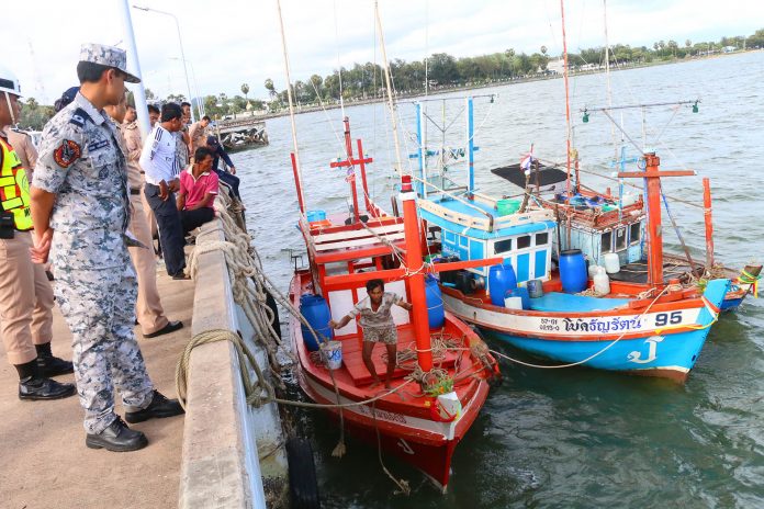 Navy officials in Chonburi province seize fishing boats that fail to comply with fishery regulations in May 2016.