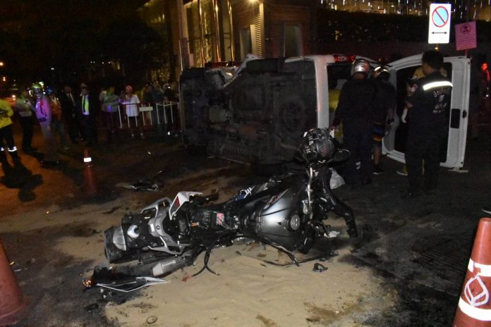 Rescue workers at the scene of a car crash Monday night in Bangkok that killed two Hungarian men. Rescue workers at the scene of a car crash Monday night in Bangkok that killed two Hungarian men.