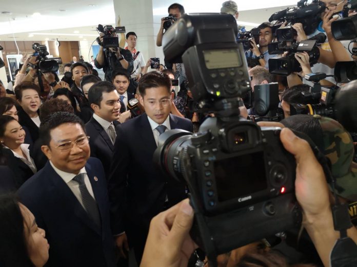 Thai Raksa Chart Party leader Preechapol Pongpanich talks to reporters Friday morning outside the Election Commission in Bangkok. Thai Raksa Chart Party leader Preechapol Pongpanich talks to reporters Friday morning outside the Election Commission in Bangkok.