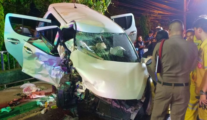 Police and rescue workers stand at the scene of car crash Thursday night that killed a policeman and his wife in Bangkok. Police and rescue workers stand at the scene of car crash Thursday night that killed a policeman and his wife in Bangkok.