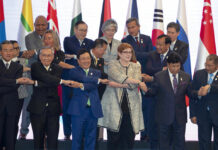 Asia-Pacific Ministers Push Dialogue to End Region’s Spats Foreign ministers, front row from left, China's Wang Yi, Thailand's Don Pramudwinai, Vietnam's Phạm Binh Minh, Australia's Marise Payne, Bangladesh's Abdul Momen and Brunei Second Minister of Foreign Affairs and Trade Erywan Yusof join hands for a group photo during the Association of Southeast Asian Nations (ASEAN) Regional Forum in Bangkok, Thailand, Friday, Aug. 2, 2019. Photo: Gemunu Amarasinghe / AP