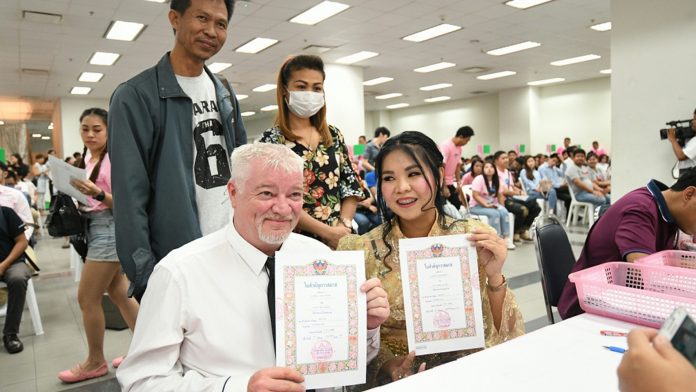 A foreign man and Thai woman register their marriage in Bangkok on Feb. 14, 2019.