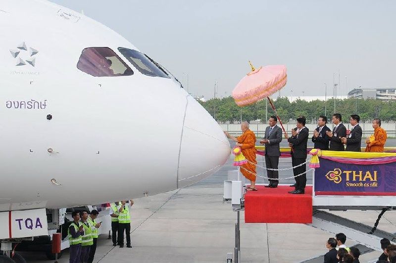 A monk blesses a Boeing plane newly acquired by Thai Airways at Suvarnabhumi Airport, 28 October 2014
