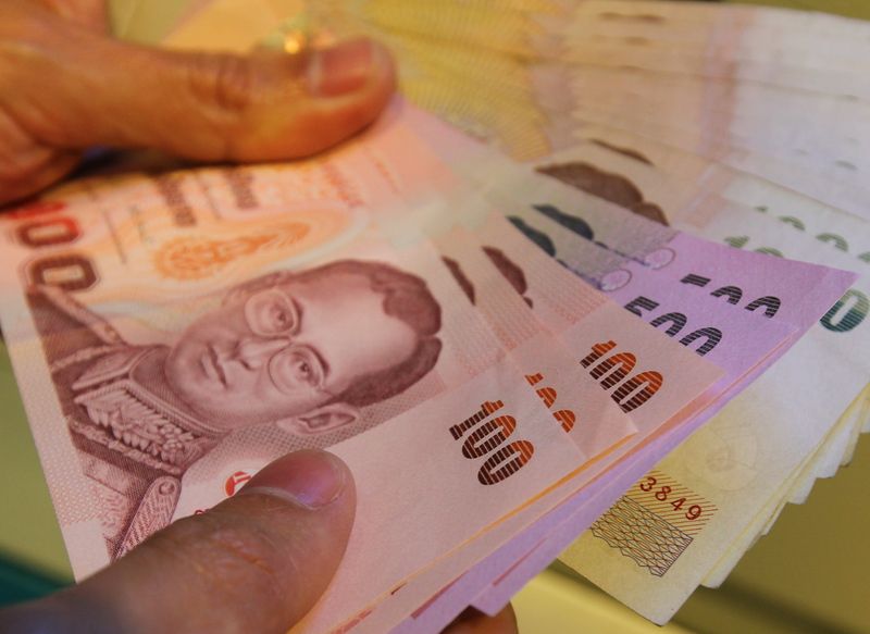A file photo shows cash (L-R) 100, 500 and 1000 Thai baht from an ATM machine in Bangkok, Thailand, 01 February 2012. EPA/NARONG SANGNAK<br />