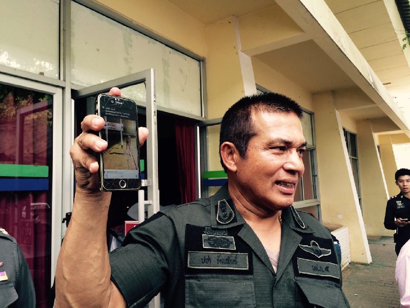 Pol.Maj.Gen. Pacha Rattapan showing one of the nude photos on his phone, 3 June 2015.<br />