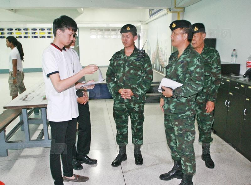 Soldiers speaking to students at Ramkhamhaeng University, where they had originally scheduled to hold a panel on the junta's charter, 27 June 2015.
