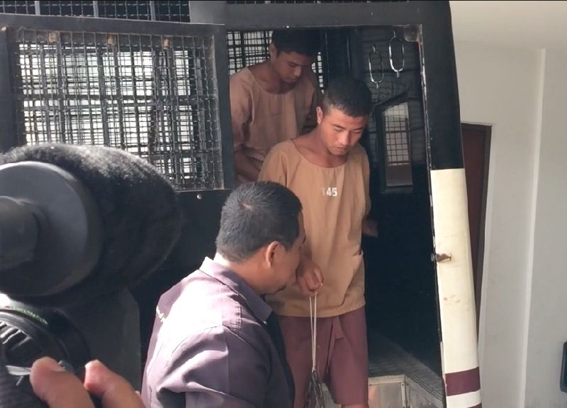 Police bring Zaw Lin and Wai Phyo to Koh Samui court on 9 July 2015.