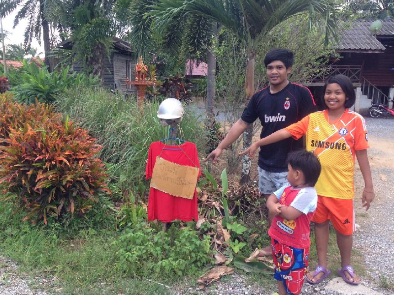 Residents of Baan Tai village in Krabi province field deployed red T-shirts and other creative displays to ward off soul-starved ghosts.