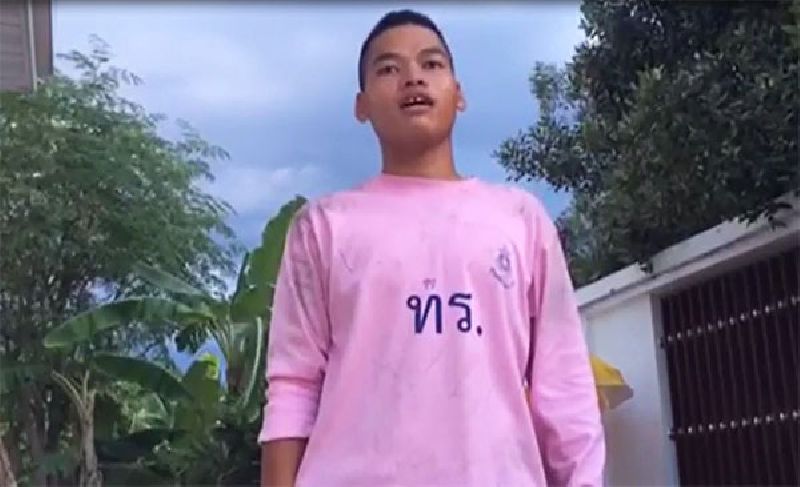 A still image from a video sent to the media by Rear Adm. Benjaporn Bawornsuwan showing Pvt. Anek Thongvichit trying – and failing – to sing the national anthem.