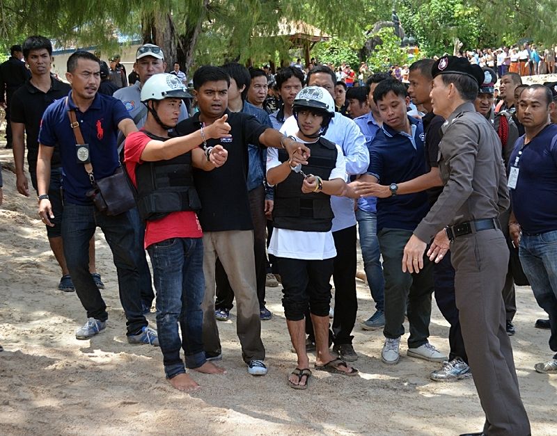 Zaw Lin and Wai Phyo are guided through a 're-enactment' of this past September's double-murder on Koh Tao in this 3 Oct., 2014, file photo.