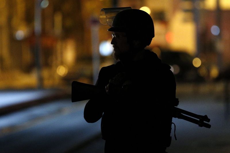 A member of the French police participates in a police operation today in the city center of Saint Denis, near Paris, France. Photo: EPA / Yoan Valat<br />