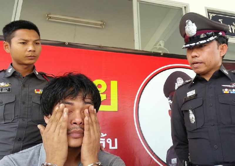 Sunthorn Khunkamdee, 26, wipes away tears as he speaks today to reporters at a police news conference in Chonburi province.