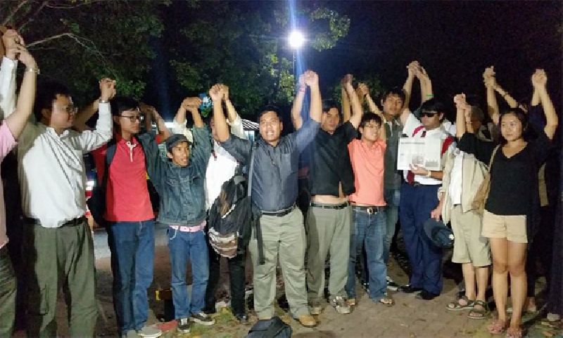 Members of the League of Liberal Thammasat for Democracy, including leader Sirawith Seritiwat, fourth from left, celebrate their Monday night release in the capital’s Phuttamonthon district. Photo: League of Liberal Thammasat for Democracy / Facebook