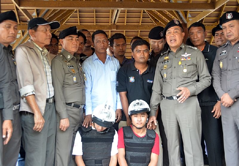 In this Oct. 3, 2014, file photo, police presented Zaw Lin and Wai Phyo to a crowd of reporters on Tao island.