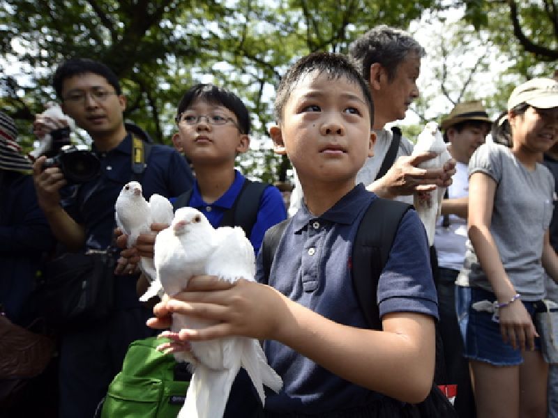 A tribute to the war dead during a ceremony at the controversial Yasukuni Shrine precinct in Tokyo, on Aug. 15, the day of the 70th anniversary of the end of World War II. Photo: Franck Robichon / EPA