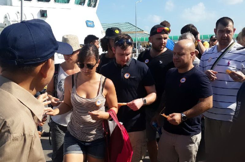 Tourists board a ferry bound for Koh Tao from a pier in Surat Thani mainland on Dec. 30, 2015.