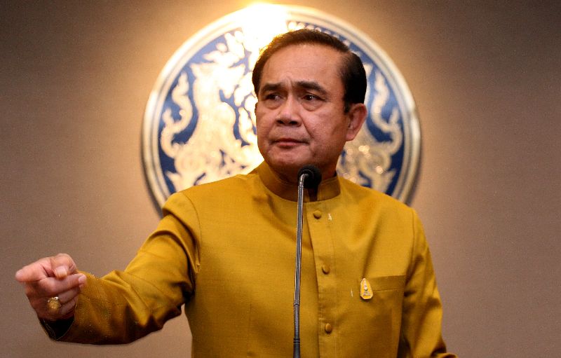 Gen. Prayuth Chan-ocha speaks to reporters Tuesday at Government House in Bangkok