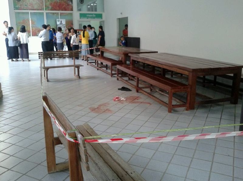 Blood marks the scene of a fatal shooting Friday morning in the main administrative building of Thammasat University’s Rangsit campus.