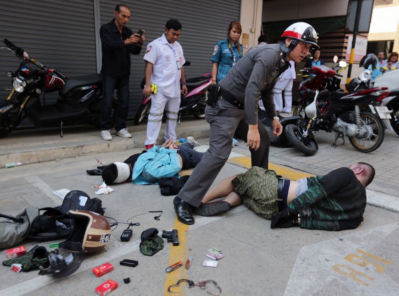 Scene from the attempted robbery at Inter Arms gun store in Bangkok on Friday