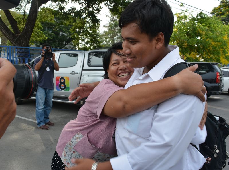 Patnaree Chankij embraces her son, student activist Sirawith Seritiwat, outside the Bangkok women’s prison where she was released Sunday.