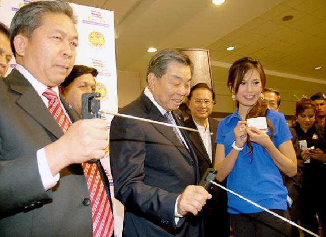 Minister of Interior Affairs Chaovarat Chanweerakul, center, on Dec. 3, 2009, demonstrates the so-called