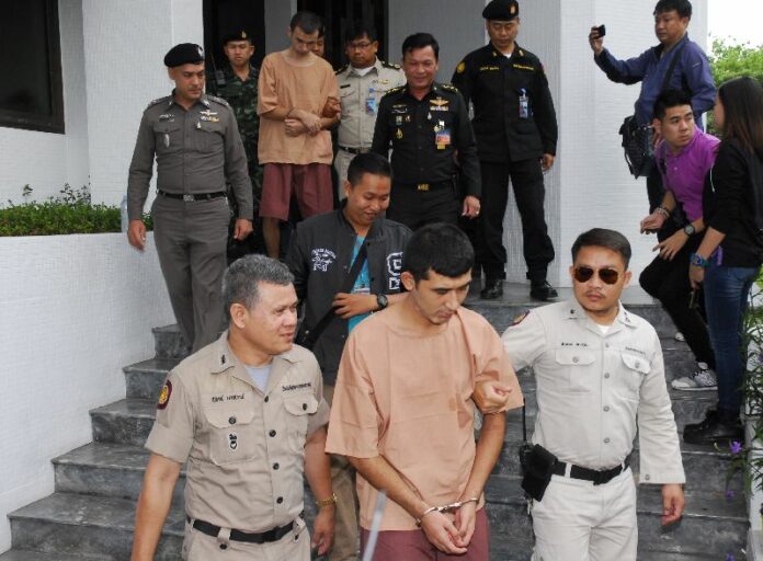 Security officers escort Mohammad Bilal and Yusufu Mieraili to the martial court in Bangkok, Nov. 12, 2015