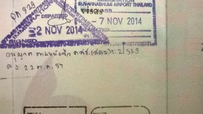 The text in Thai states that this author was granted special permission to leave Thailand in 2014.