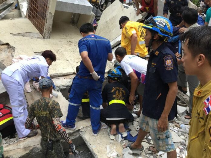 Rescue workers search through the remains of Siam Beach Hotel Saturday morning on Koh Chang.