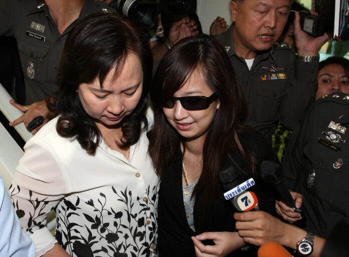 Orachorn ‘Praewa’ Thephasadin Na Ayudhya turns herself in at the Metropolitan Police Bureau headquarters in 2011 in Bangkok.